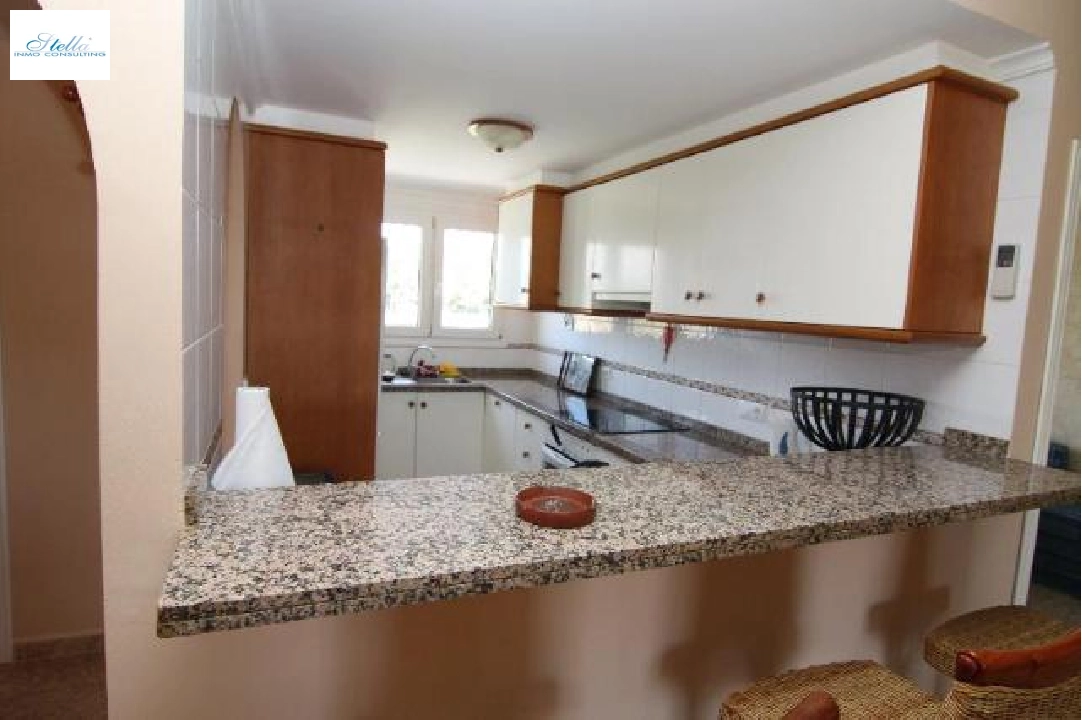 Kitchen with serving hatch to dining room